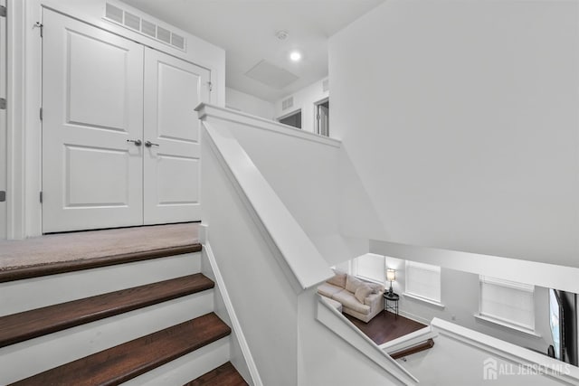 stairway featuring recessed lighting and visible vents