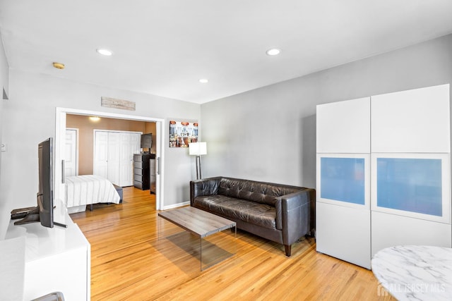 living room featuring recessed lighting and light wood-style flooring