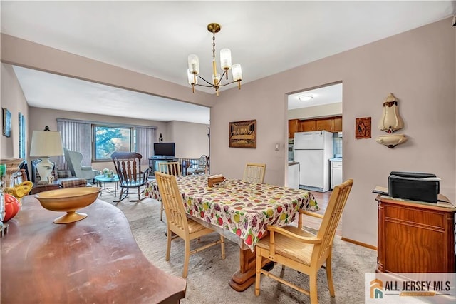 20 Kennedy St, Iselin, NJ 08830 - dining space with a chandelier and light carpet