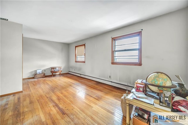 20 Kennedy St, Iselin, NJ 08830 - spare room featuring a baseboard heating unit and light wood-type flooring