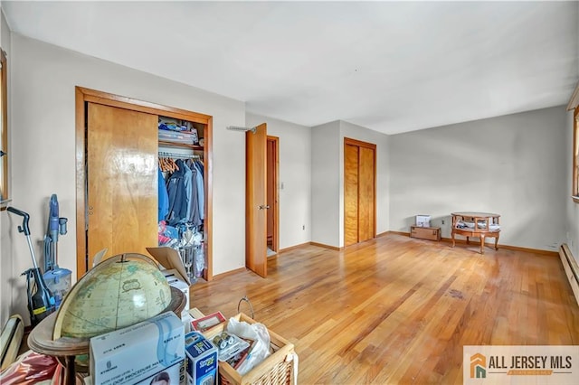 20 Kennedy St, Iselin, NJ 08830 - misc room with light wood-type flooring and baseboard heating