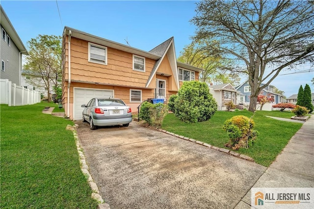 20 Kennedy St, Iselin, NJ 08830 - view of front of property featuring driveway and a garage