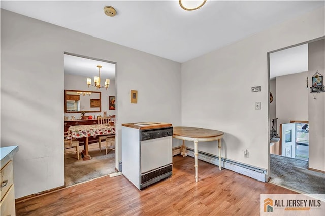20 Kennedy St, Iselin, NJ 08830 - dining space featuring light wood-style floors, a chandelier, and a baseboard radiator