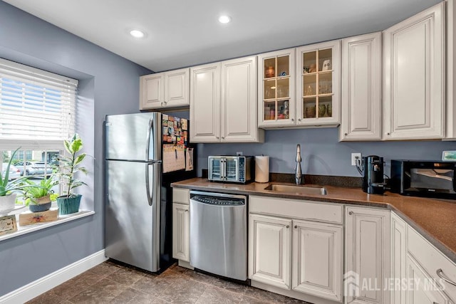 223 Perth Hill Ct, Matawan, NJ 07747 - kitchen featuring appliances with stainless steel finishes, a sink, white cabinets, baseboards, and glass insert cabinets