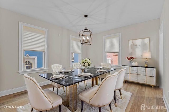 307 Wayne St, Highland Park, NJ 08904 - dining area featuring a chandelier and light wood-style floors