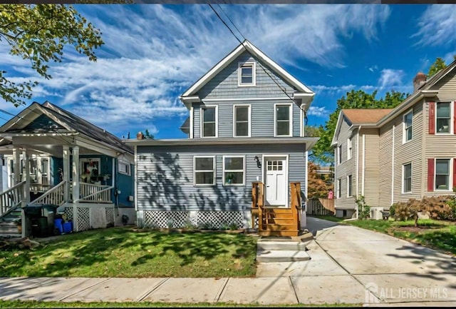 307 Wayne St, Highland Park, NJ 08904 - view of front of house featuring a front yard, entry steps, and covered porch