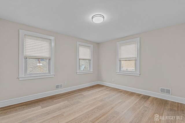 307 Wayne St, Highland Park, NJ 08904 - unfurnished room featuring light wood-style flooring and baseboards