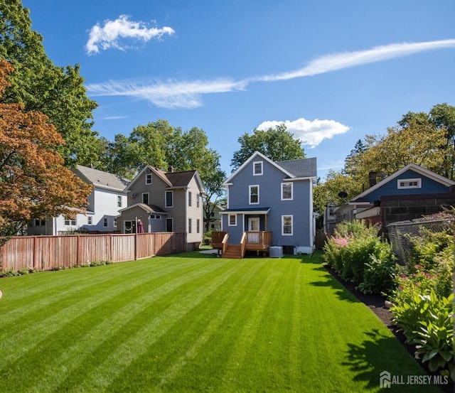 307 Wayne St, Highland Park, NJ 08904 - rear view of property with a deck and a residential view