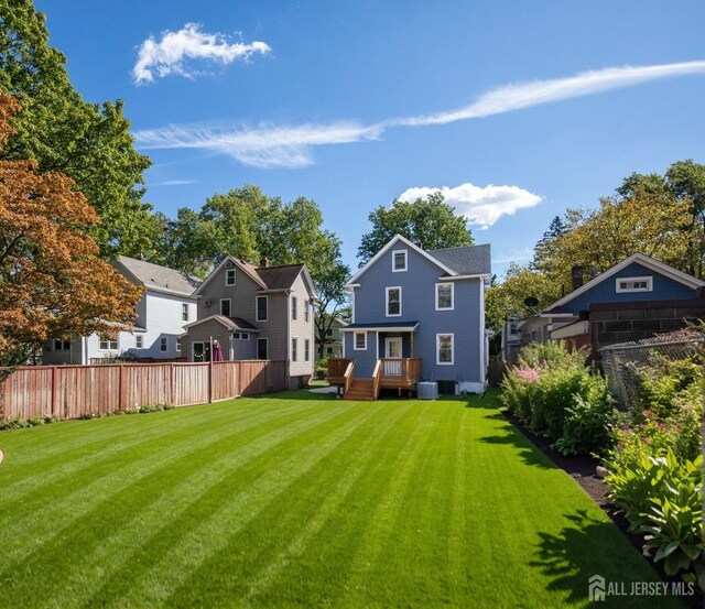 307 Wayne St, Highland Park, NJ 08904 - rear view of property with a deck and a residential view