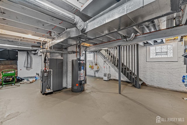 307 Wayne St, Highland Park, NJ 08904 - basement with water heater, heating unit, and stairway