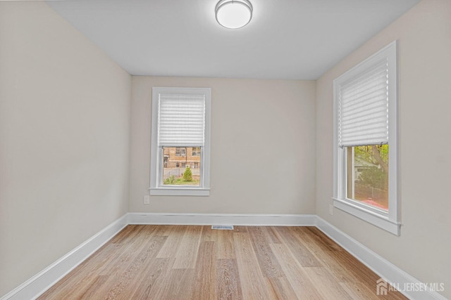 307 Wayne St, Highland Park, NJ 08904 - empty room with light wood-style floors and baseboards