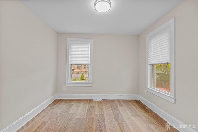 307 Wayne St, Highland Park, NJ 08904 - empty room with light wood-style floors and baseboards