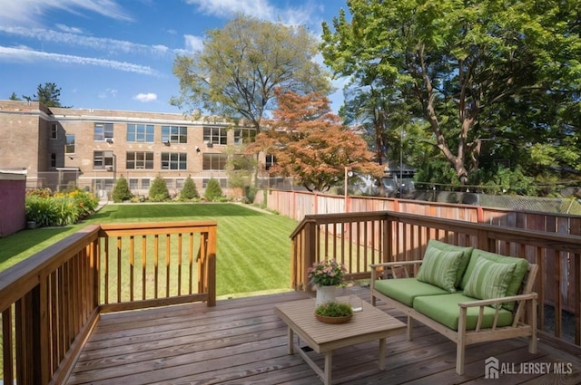 307 Wayne St, Highland Park, NJ 08904 - wooden deck with outdoor lounge area and a fenced backyard