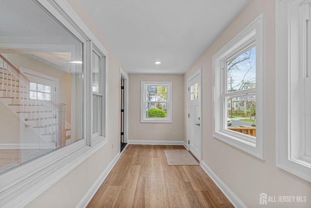 307 Wayne St, Highland Park, NJ 08904 - doorway to outside with light wood-style floors, stairs, and recessed lighting