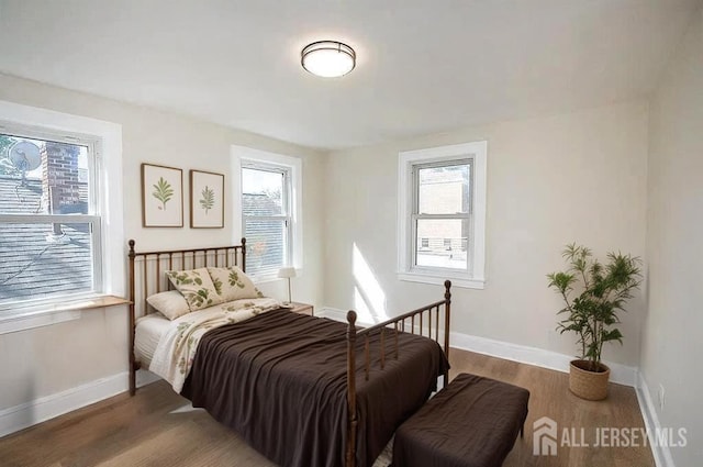 307 Wayne St, Highland Park, NJ 08904 - bedroom with multiple windows and wood finished floors