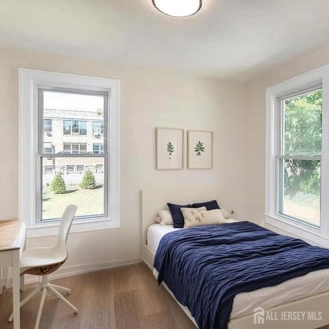 307 Wayne St, Highland Park, NJ 08904 - bedroom with wood finished floors and baseboards