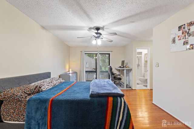 bedroom featuring ensuite bathroom, a textured ceiling, a ceiling fan, access to exterior, and wood finished floors