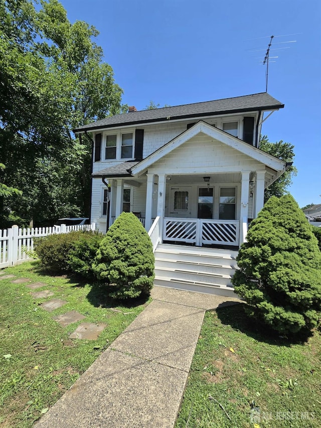 237 Prospect Ave, Dunellen, NJ 08812 - view of front of home with a porch, a chimney, and roof with shingles