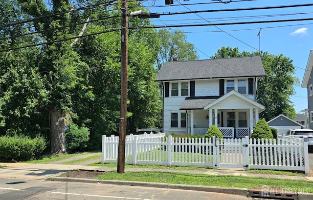 237 Prospect Ave, Dunellen, NJ 08812 - view of front facade featuring a fenced front yard, a shingled roof, covered porch, and a gate
