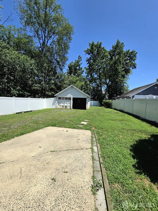 237 Prospect Ave, Dunellen, NJ 08812 - fenced backyard featuring a garage and a patio area