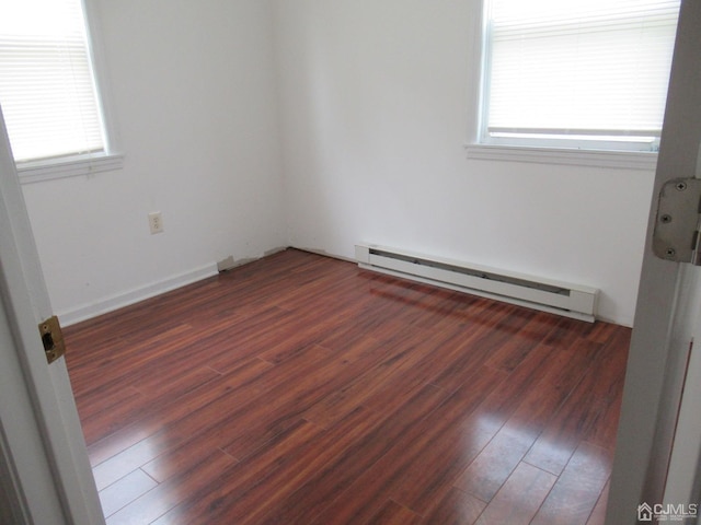 68 Macarthur Ave, Sayreville, NJ 08872 - empty room with baseboard heating and wood finished floors