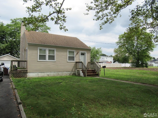 68 Macarthur Ave, Sayreville, NJ 08872 - view of front of home featuring a chimney, roof with shingles, and an outbuilding