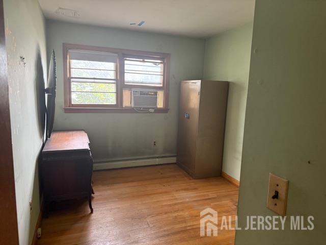 397 Lake Ave, Colonia, NJ 07067 - sitting room with a baseboard radiator, cooling unit, and light wood-style floors