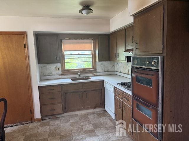 397 Lake Ave, Colonia, NJ 07067 - kitchen with double oven, light countertops, white dishwasher, and tasteful backsplash