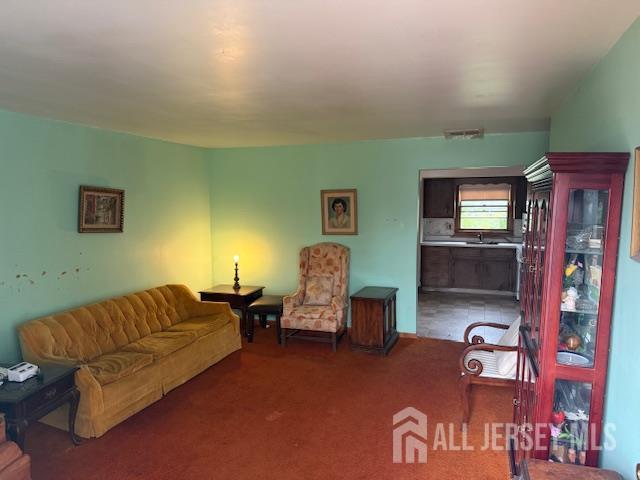 397 Lake Ave, Colonia, NJ 07067 - living area with light colored carpet