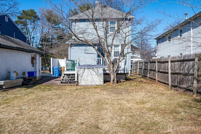 view of yard with a deck and fence