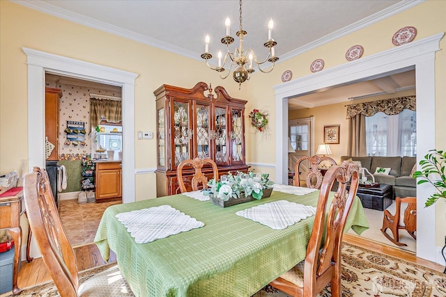 dining area with an inviting chandelier and crown molding