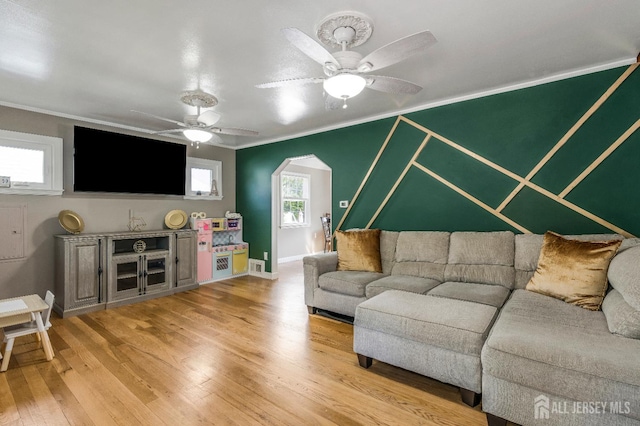 324 Greene Ave, Middlesex, NJ 08846 - living area with crown molding, a ceiling fan, light wood finished floors, and arched walkways
