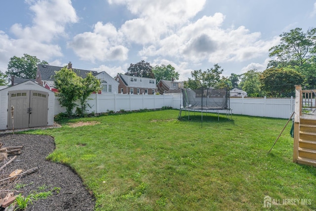 324 Greene Ave, Middlesex, NJ 08846 - fenced backyard with a storage unit and a trampoline