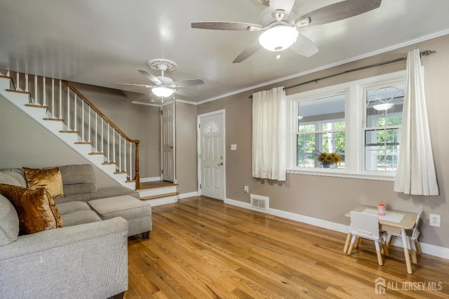 324 Greene Ave, Middlesex, NJ 08846 - foyer entrance featuring stairway, ceiling fan, ornamental molding, and wood finished floors