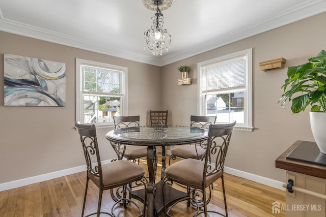 324 Greene Ave, Middlesex, NJ 08846 - dining area with light wood-style floors, ornamental molding, and a chandelier