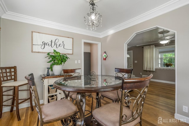 324 Greene Ave, Middlesex, NJ 08846 - dining area with wood finished floors, ornamental molding, arched walkways, and a ceiling fan