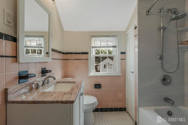 324 Greene Ave, Middlesex, NJ 08846 - full bathroom featuring tile walls, healthy amount of natural light, vanity, tile patterned floors, and lofted ceiling