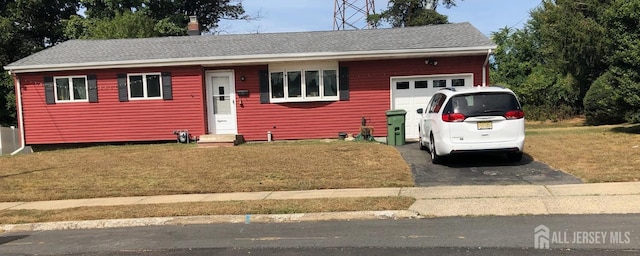 ranch-style house with a front lawn and a garage