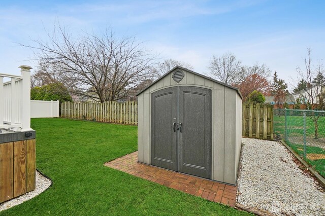 view of shed featuring a fenced backyard