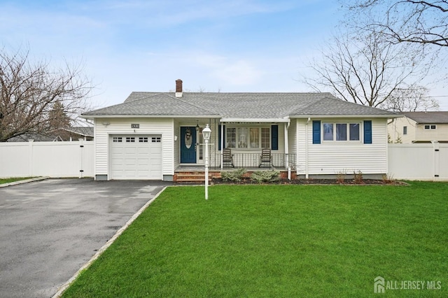 ranch-style house featuring driveway, an attached garage, fence, a shingled roof, and covered porch