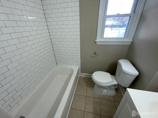 520 Hayward St, Bound Brook, NJ 08805 - full bathroom featuring tile patterned flooring, toilet, a tub, baseboards, and a shower