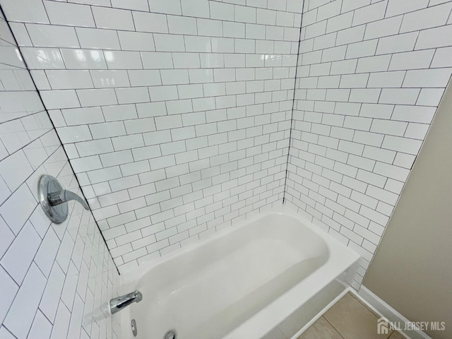 520 Hayward St, Bound Brook, NJ 08805 - bathroom with baseboards, tile patterned flooring, and tub / shower combination
