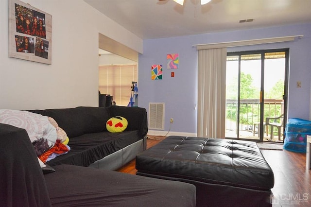 living room with ceiling fan and hardwood / wood-style floors