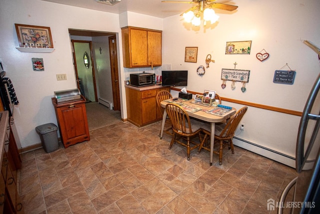 282 Bridgepoint Rd, Montgomery, NJ 08502 - dining area featuring a baseboard radiator, ceiling fan, stone finish flooring, and an office area
