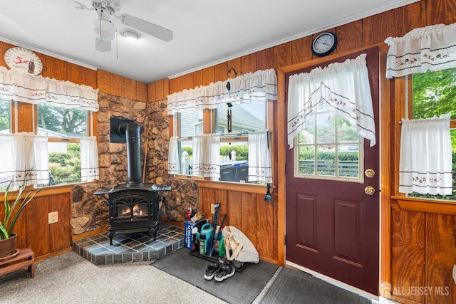 13 Quincy Rd, East Brunswick, NJ 08816 - carpeted foyer featuring a wood stove, plenty of natural light, and wood walls