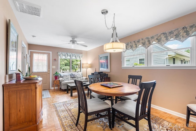 13 Quincy Rd, East Brunswick, NJ 08816 - dining room featuring baseboards and ceiling fan