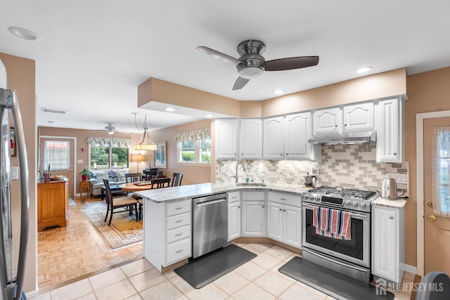13 Quincy Rd, East Brunswick, NJ 08816 - kitchen featuring stainless steel appliances, ceiling fan, under cabinet range hood, a peninsula, and recessed lighting