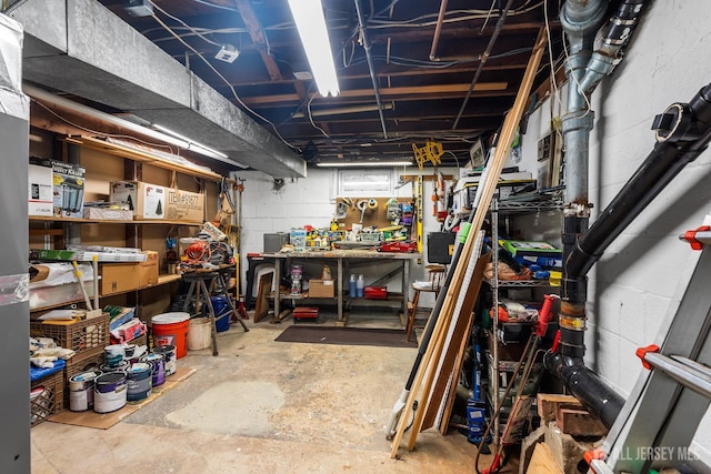13 Quincy Rd, East Brunswick, NJ 08816 - unfinished below grade area featuring a workshop area and concrete block wall