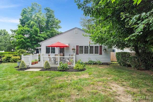13 Quincy Rd, East Brunswick, NJ 08816 - back of house featuring a wooden deck
