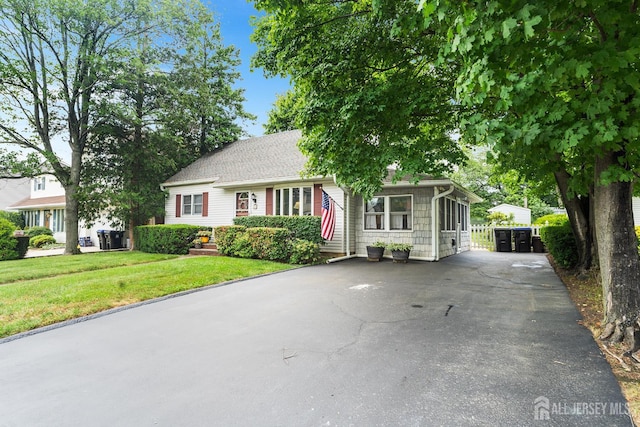 13 Quincy Rd, East Brunswick, NJ 08816 - view of front of house featuring a front lawn and driveway